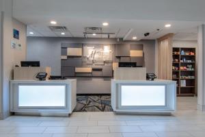 a lobby with two blank signs in a room at Holiday Inn Express & Suites - Indianapolis Northwest, an IHG Hotel in Indianapolis