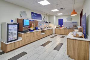 a fast food restaurant with wooden counters and aasteryasteryasteryasteryasteryasteryastery at Holiday Inn Express & Suites El Paso East-Loop 375 by IHG in El Paso