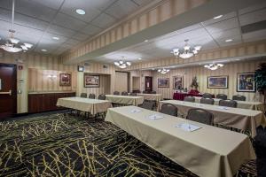 a banquet room with tables and chairs and chandeliers at Holiday Inn Express Hotel & Suites Youngstown North-Warren/Niles by IHG in Warren +31 photos
