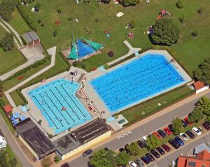an overhead view of two swimming pools in a park at Gräfin von Paris - Appartement mit Saunanutzung in Burgbernheim