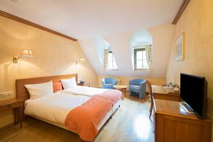 
Ein Bett oder Betten in einem Zimmer der Unterkunft Aux Tanneries de Wiltz
