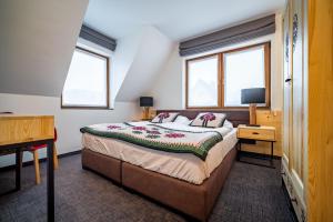 Katil atau katil-katil dalam bilik di Apartamenty Góralskie Zakopane