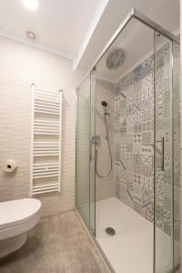 a bathroom with a shower and a toilet at Apartment Stella in Opatija