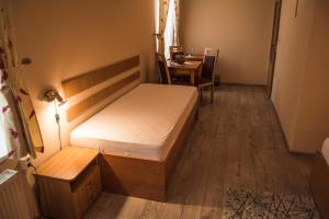 Postel nebo postele na pokoji v ubytování Hotel Roháč