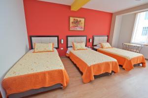 Postel nebo postele na pokoji v ubytování Plaza Sur Hotel & Suites