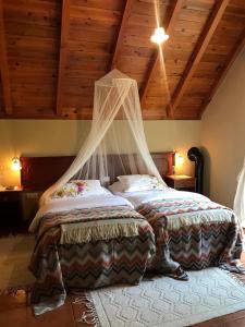 Кровать или кровати в номере Palheirinho da Camélia