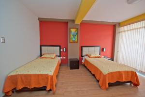 Postel nebo postele na pokoji v ubytování Plaza Sur Hotel & Suites