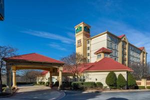 a building with a clock tower on top of it at La Quinta by Wyndham Greenville Haywood in Greenville