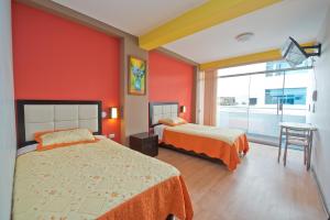 Postel nebo postele na pokoji v ubytování Plaza Sur Hotel & Suites