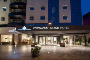 an entrance to a grand hotel with a building at Athenaeum Grand Hotel in Athens