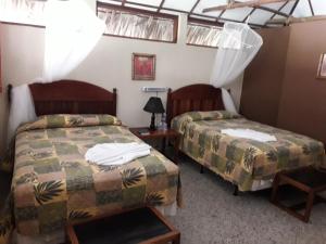 Hotel Tikal Inn客房内的一张或多张床位