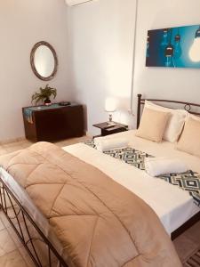 A bed or beds in a room at Traditional House “AVLI” Még 23 kép