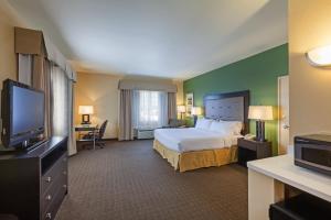 A bed or beds in a room at Holiday Inn Express Hotel & Suites Eagle Pass, an IHG Hotel