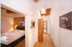 a small bedroom with a bed and a window at Edelweiss am See in Zell am See