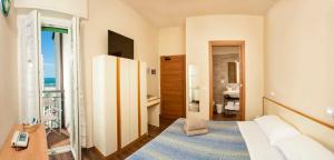 Postel nebo postele na pokoji v ubytování Hotel Sayonara
