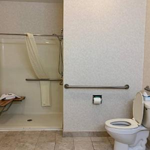 a bathroom with a toilet and a shower at Super 8 by Wyndham Albany in Albany