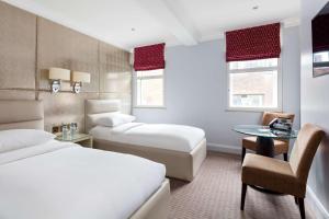 
A bed or beds in a room at Radisson Blu Edwardian Mercer Street Hotel, London
