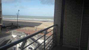 a balcony with a view of the beach at Belvedere 2.3 in Blankenberge