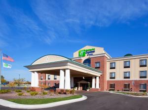a hotel with a sign on the front of it at Holiday Inn Express Hotel & Suites Bay City, an IHG Hotel in Bay City