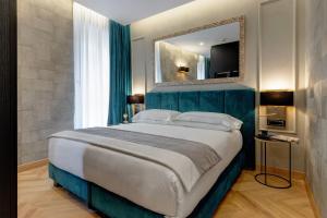 A bed or beds in a room at Dharma Boutique Hotel & SPA Még 36 kép