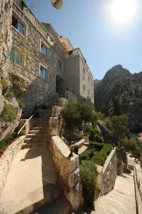 a building on the side of a mountain at Hotel Villa Dvor in Omiš