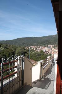 a balcony with a view of a city at Appartamenti Amaretto e Pardula in Fluminimaggiore