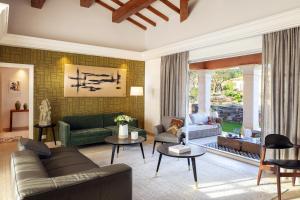 a living room with a couch and a table at Domaine de l'Astragale in Saint-Tropez