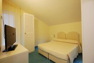 Postel nebo postele na pokoji v ubytování Residence Abruzzo Resort