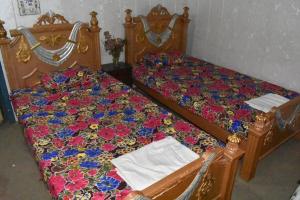 Cama o camas de una habitación en Haidery International Hotel