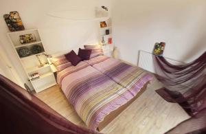 a bedroom with a large bed in a room at Bbstudio3 in Den Helder
