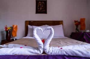Un pat sau paturi într-o cameră la Askha Cusco