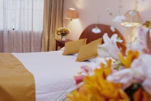 Letto o letti in una camera di Hotel Vilandre