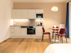 Kuchyň nebo kuchyňský kout v ubytování Premium Green Apartments Vienna