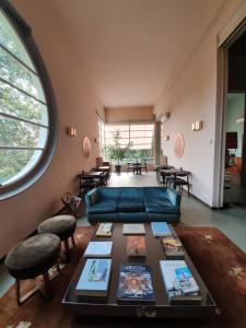 a living room with a couch and a table at Villa Gotti Charming Rooms in Bologna