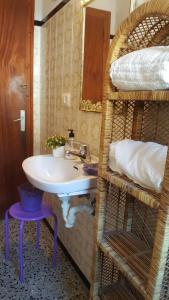 a bathroom with a sink and a mirror and bunk beds at Fonda Felip in Port de la Selva