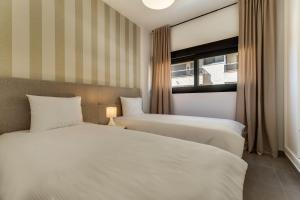 Ένα ή περισσότερα κρεβάτια σε δωμάτιο στο Calpe Beach & City - Premium +17 φωτογραφίες