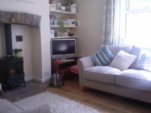 a living room with a couch and a television at Waverley in York