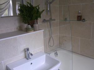 a bathroom with a sink and a shower at Waverley in York