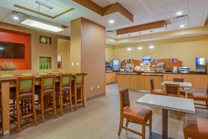 a waiting room at a fast food restaurant at Holiday Inn Express Fort Lauderdale Airport South, an IHG Hotel in Dania Beach