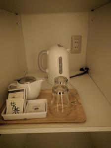 a kitchen counter with a tea pot and a blender at Bayside Square Kaike Hotel in Yonago