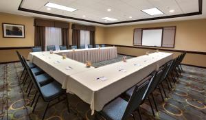 a large conference room with a long table and chairs at Holiday Inn & Suites Spring - The Woodlands in Spring