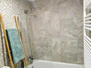 a bathroom with a shower and a bath tub at apartamento La Coqueta in Santander +9 photos