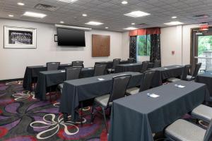 a conference room with tables and chairs and a screen at Holiday Inn Express & Suites Columbus - Polaris, an IHG Hotel in Columbus +36 photos