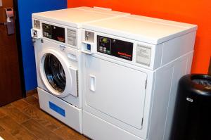 a white washer and dryer in a room at Holiday Inn Express & Suites - Miami, an IHG Hotel in Miami