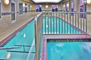 a pool in a hotel room with two pools at Holiday Inn Express & Suites - Miami, an IHG Hotel in Miami