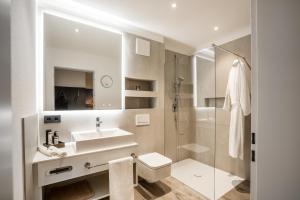 Koupelna v ubytování PRIMERA Apartments + 28 fotografií