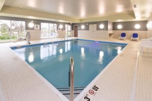 a large swimming pool in a hotel room at Holiday Inn Express & Suites - Auburn by IHG in Auburn