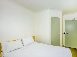 Postel nebo postele na pokoji v ubytování Imperial Motel Windsor