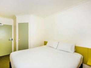 Postel nebo postele na pokoji v ubytování Imperial Motel Windsor