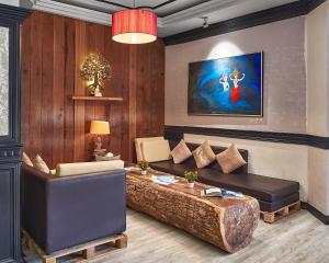a living room with a couch and a table at Pacific Hotel in Phnom Penh
